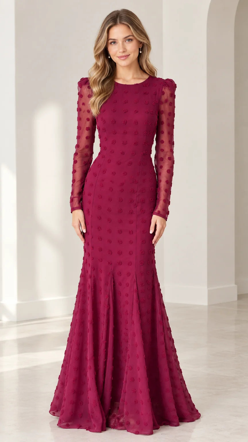 Full front view of model wearing burgundy long sleeve swiss dot mermaid evening gown