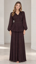 Front full-length view of woman wearing burgundy long sleeve pleated maxi dress