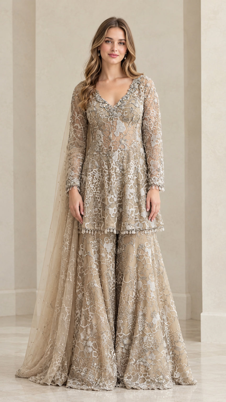 Full front view of champagne embroidered peplum sharara suit set with dupatta