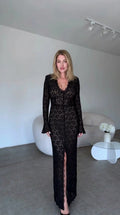 Front view of black floral lace maxi dress with scalloped V-neck and front slit