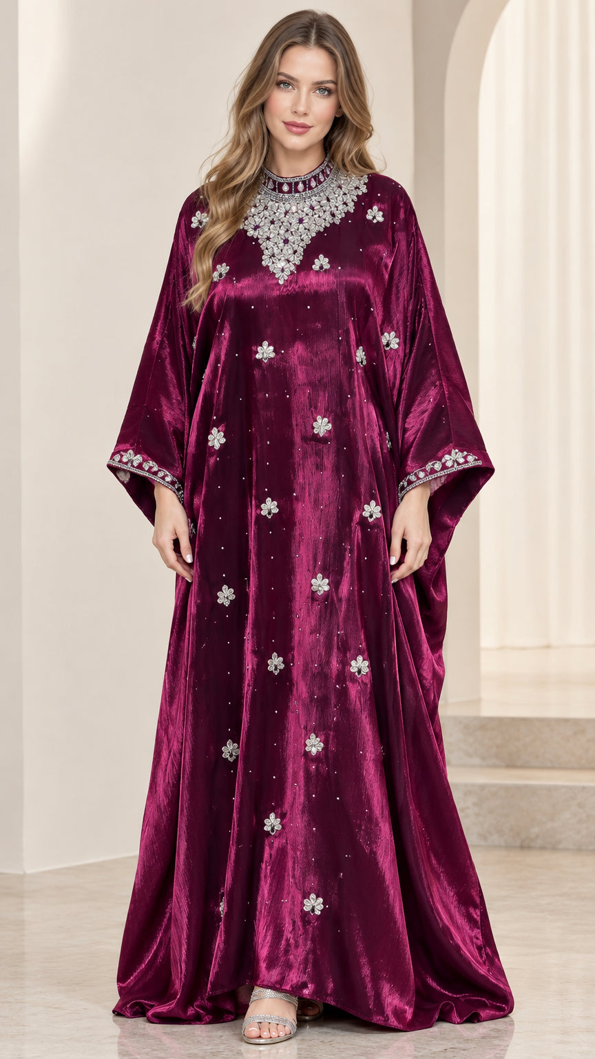 Front full view of woman wearing burgundy embellished velvet kaftan maxi dress