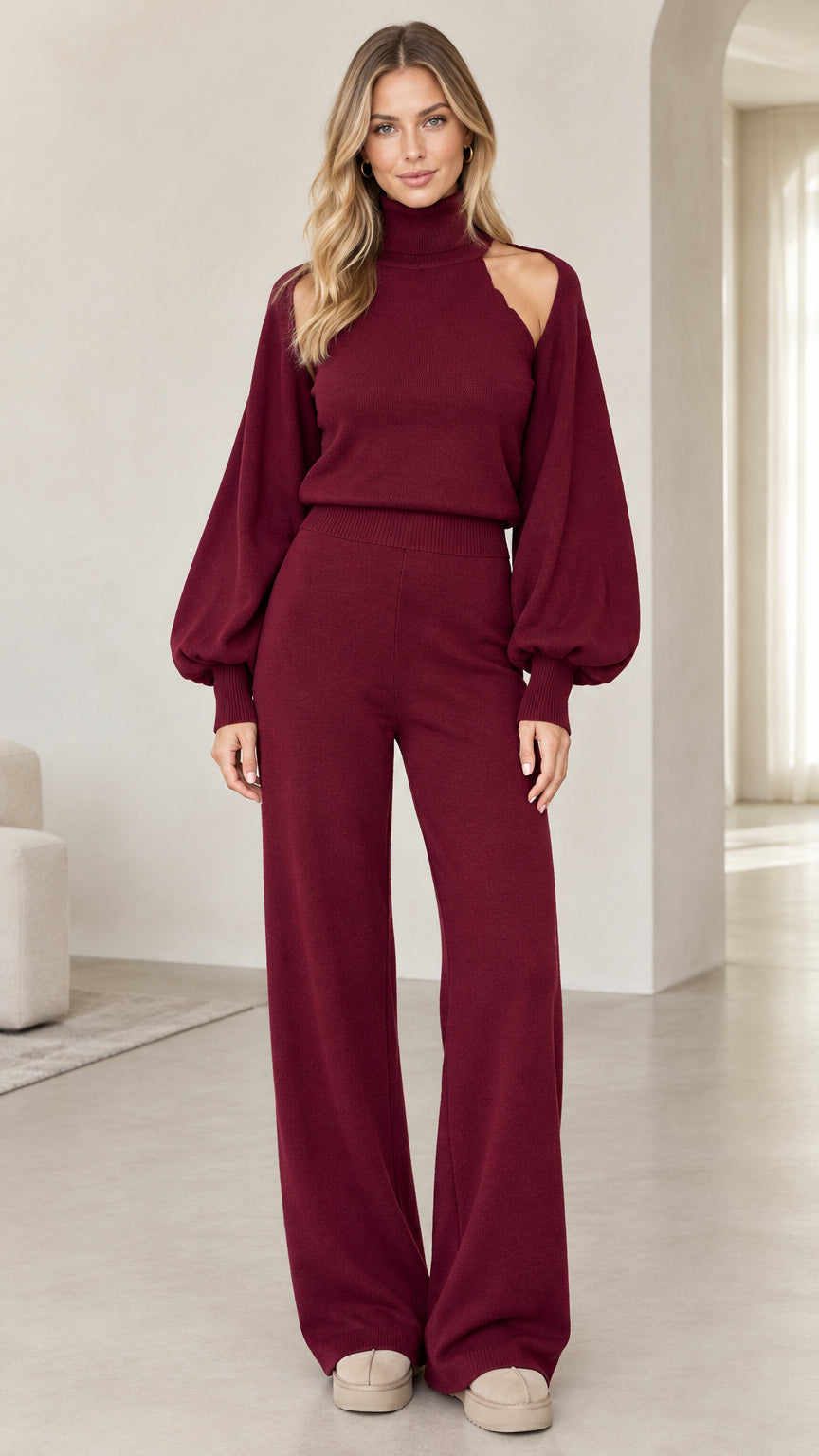 Woman wearing burgundy cutout turtleneck sweater and wide-leg knit pants set front view