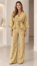 Front view of woman wearing mustard textured jacquard two-piece pants set