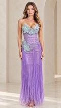 Front view of model wearing lavender strapless 3D floral applique fringe maxi evening gown