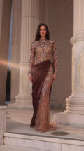 Front view of model wearing Chocolate Brown crystal embellished high-neck maxi gown with draped satin waist