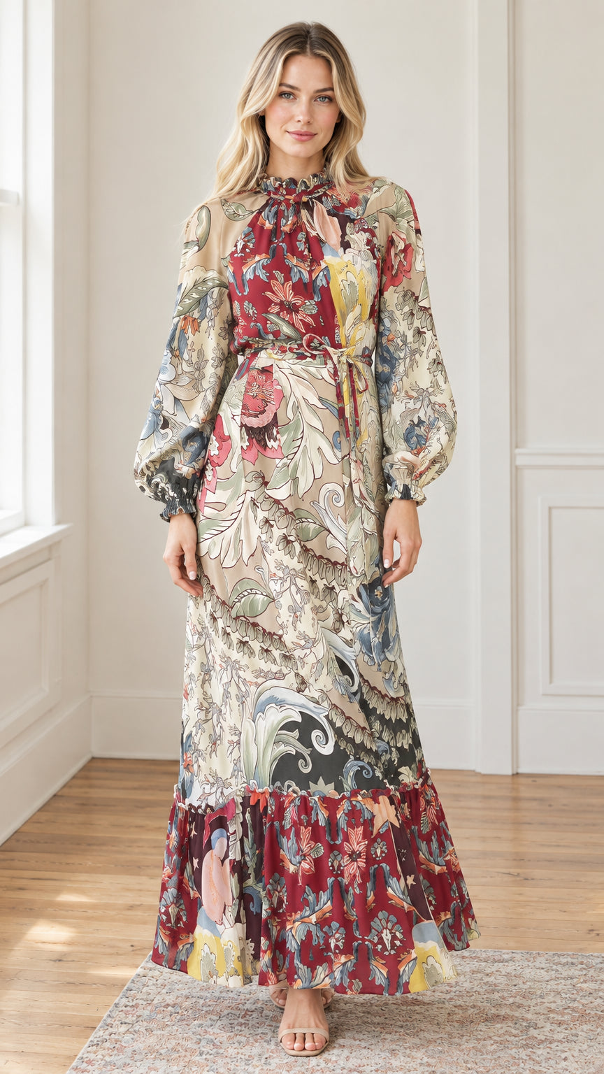 Front view of woman wearing long sleeve floral tiered maxi dress in burgundy multi