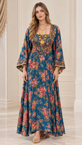 Front view of woman wearing peacock blue floral maxi dress with embroidered square neck and bell sleeves