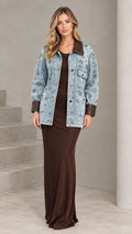 Full front view of model wearing Light Blue embellished denim jacket with brown contrast collar over a brown maxi dress