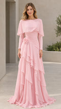 Front view of woman wearing Light Pink capelet tiered ruffle evening gown with long sleeves