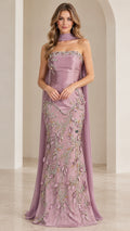 Front view of model wearing mauve strapless beaded mermaid evening gown with neck scarf cape