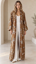 Front view of model wearing a Camel Brown floral embroidered velvet maxi kimono duster