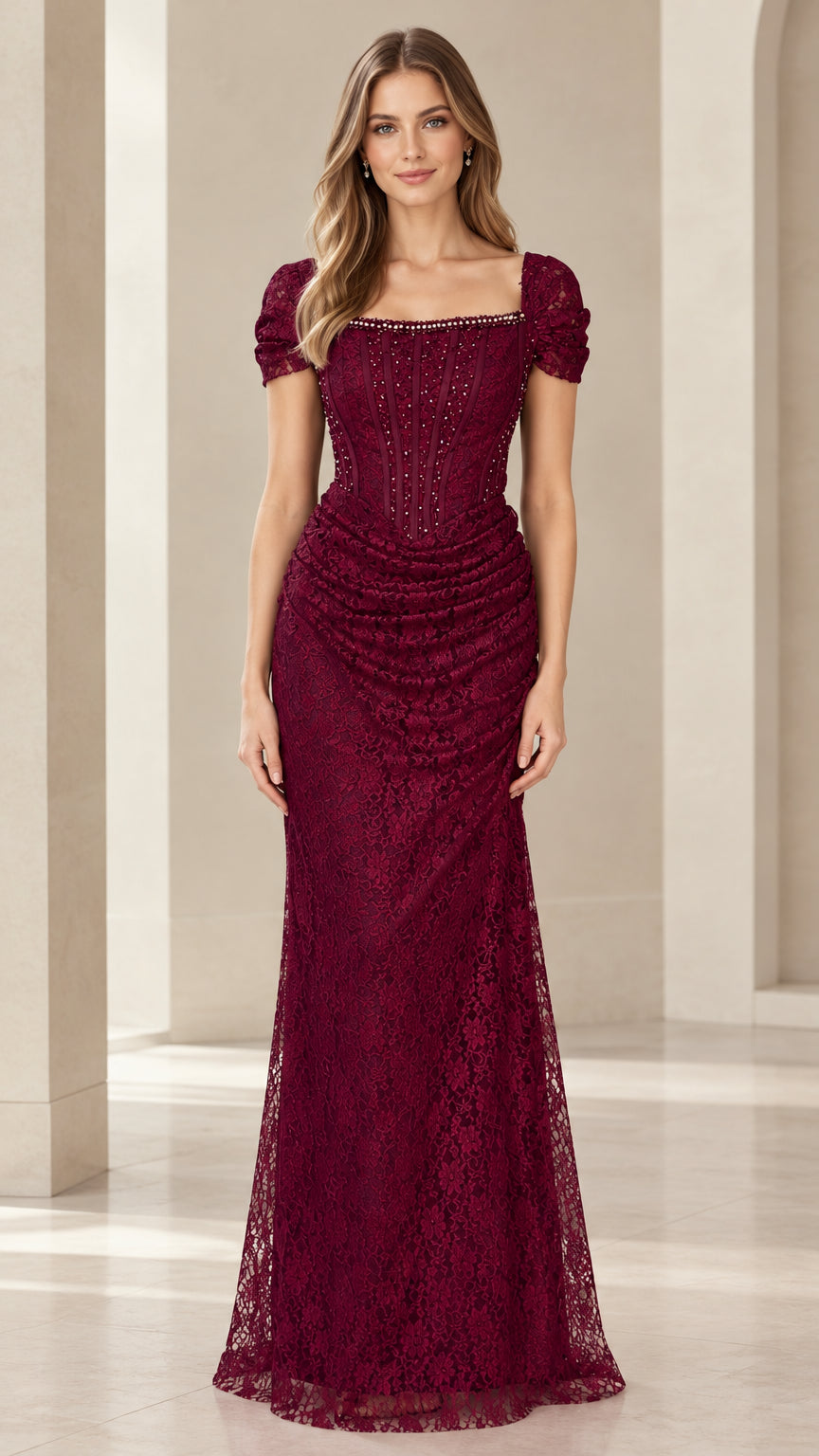 Front view of model wearing Burgundy beaded lace corset evening gown with puff sleeves