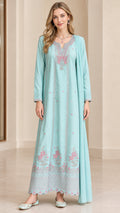 Front view of model wearing sky blue embroidered maxi dress with matching scarf