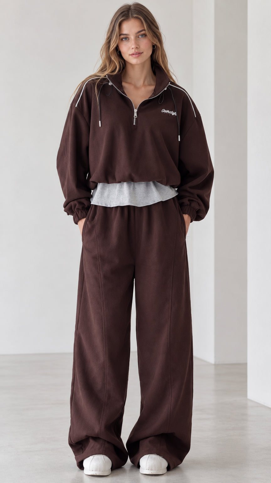 Front full view of women's chocolate brown half-zip layered pullover and wide-leg tracksuit set