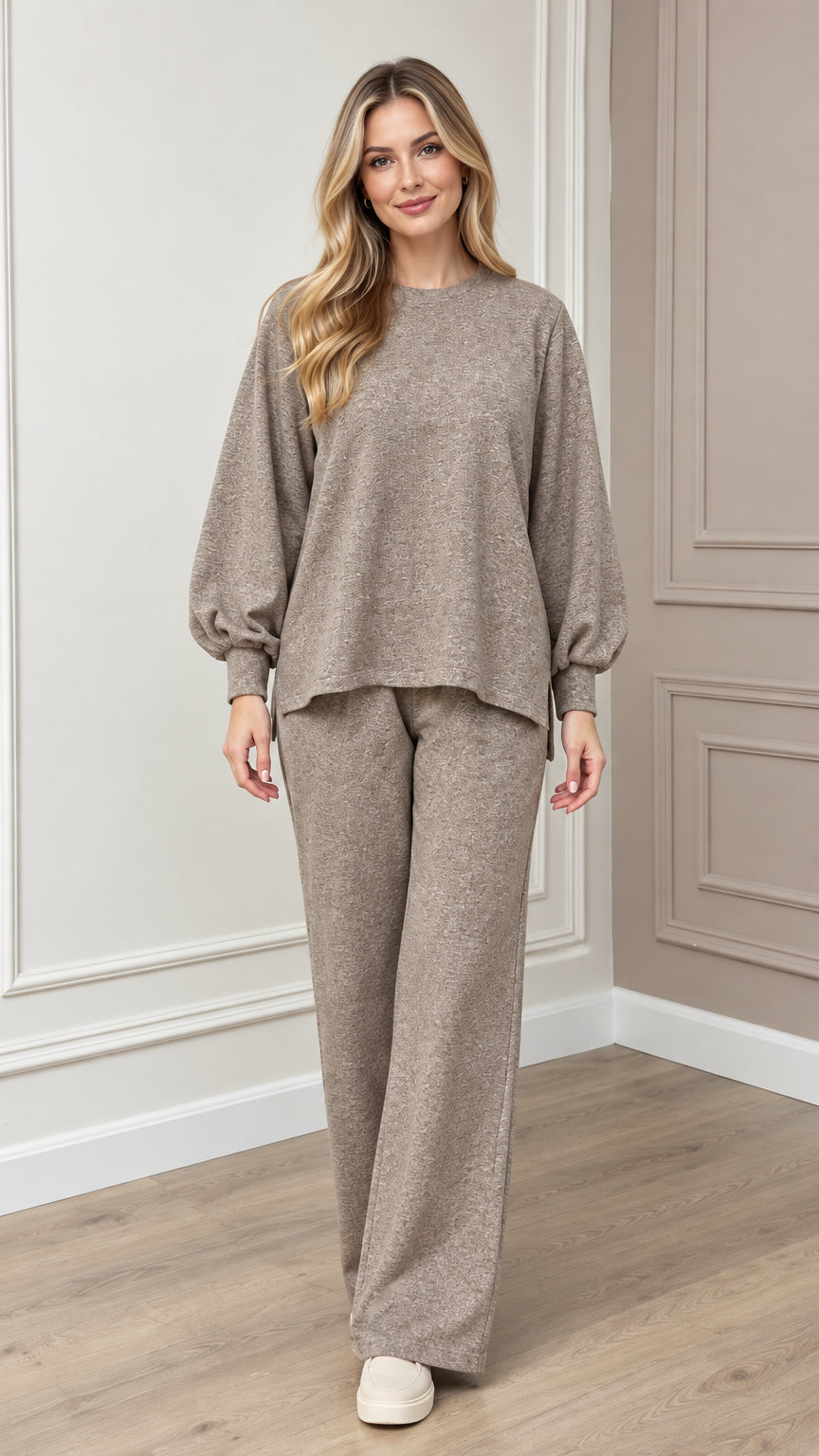 Full front view of model wearing taupe textured knit lounge set with lantern sleeves and wide-leg pants