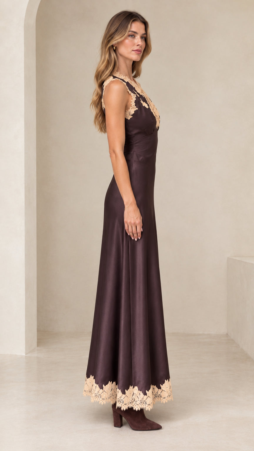 Side profile view of model wearing espresso brown satin maxi dress with lace detailing