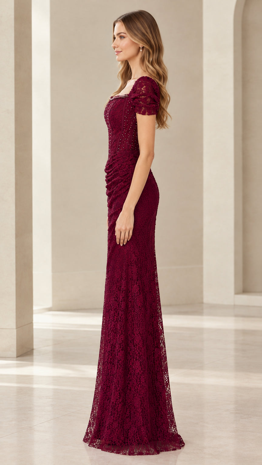 Side profile view of Burgundy floor-length lace formal gown