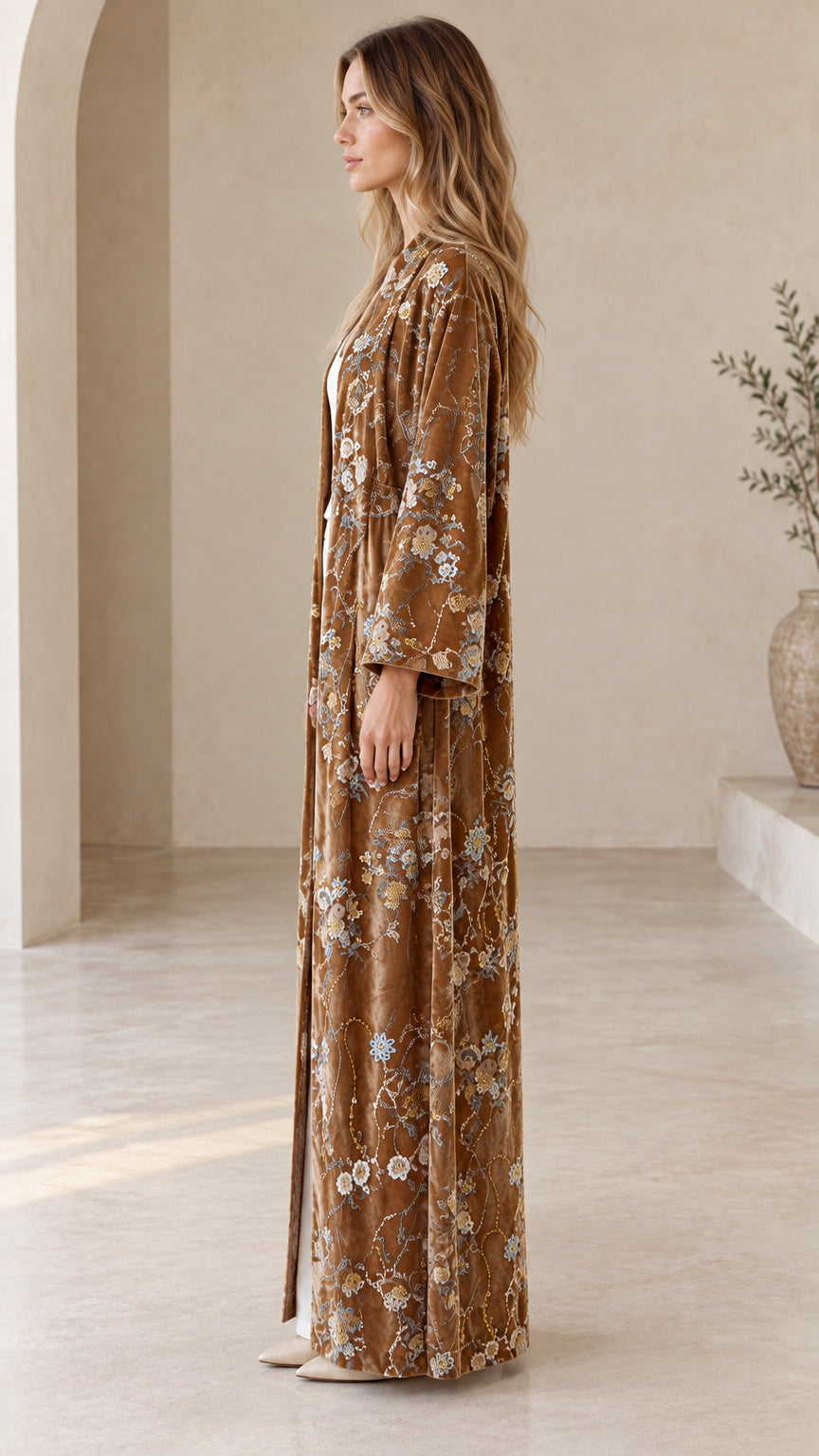 Side profile of model wearing the Camel Brown floral velvet duster kimono