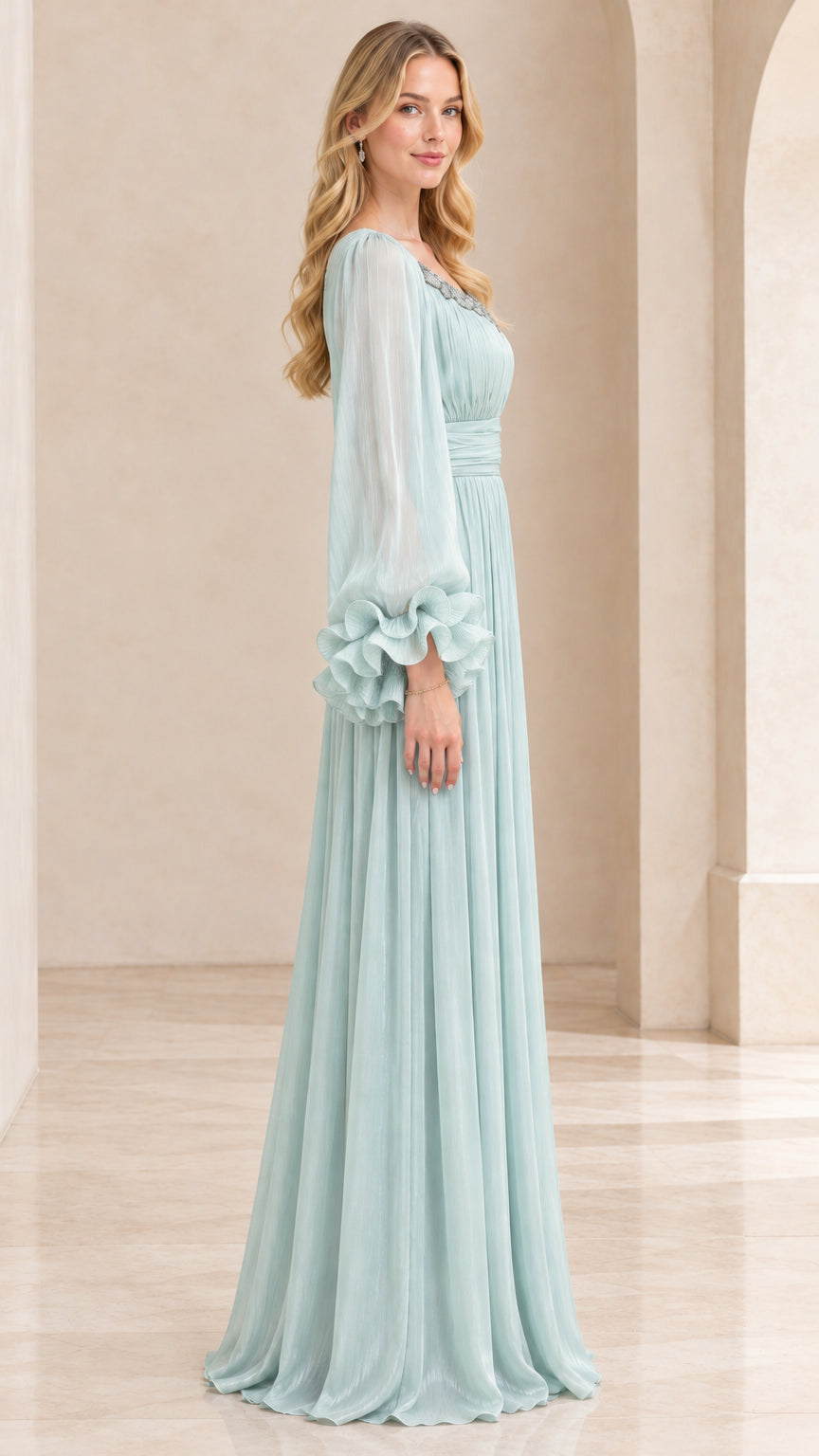 Side profile view of model in Mint Green long-sleeve evening gown with pleated skirt