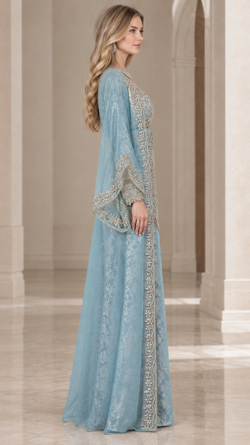 Side profile of dusty blue kaftan evening gown showing graceful drape