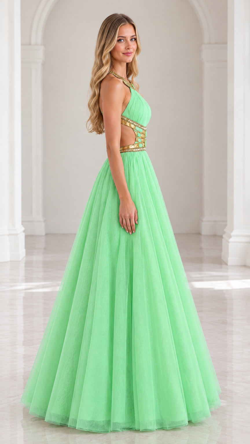 Side profile of mint green halter tulle gown showing beaded waist cutout