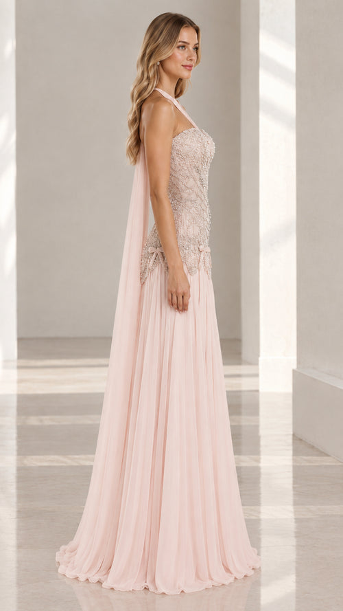 Side profile view of blush pink formal dress showcasing fit and drape