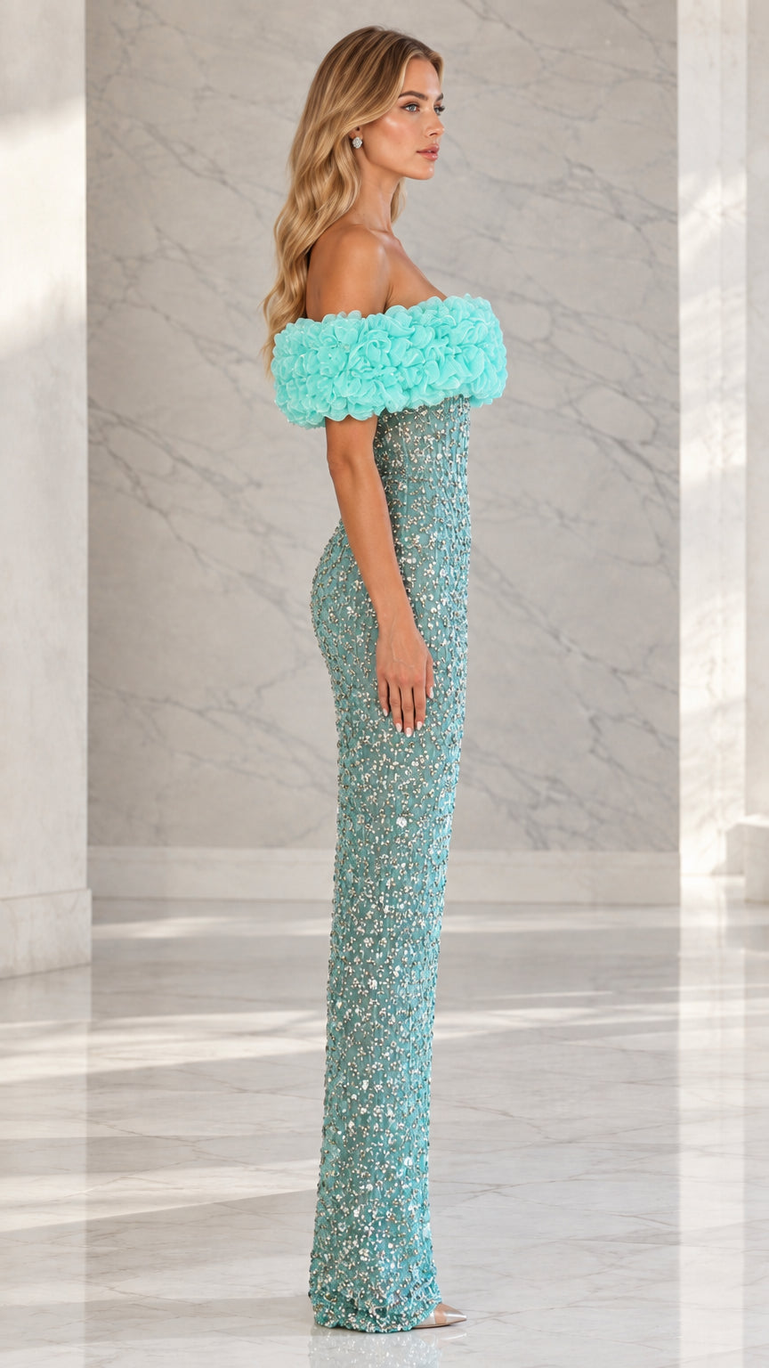 Side profile view of aqua blue embellished column gown showing sleek fit and floor length