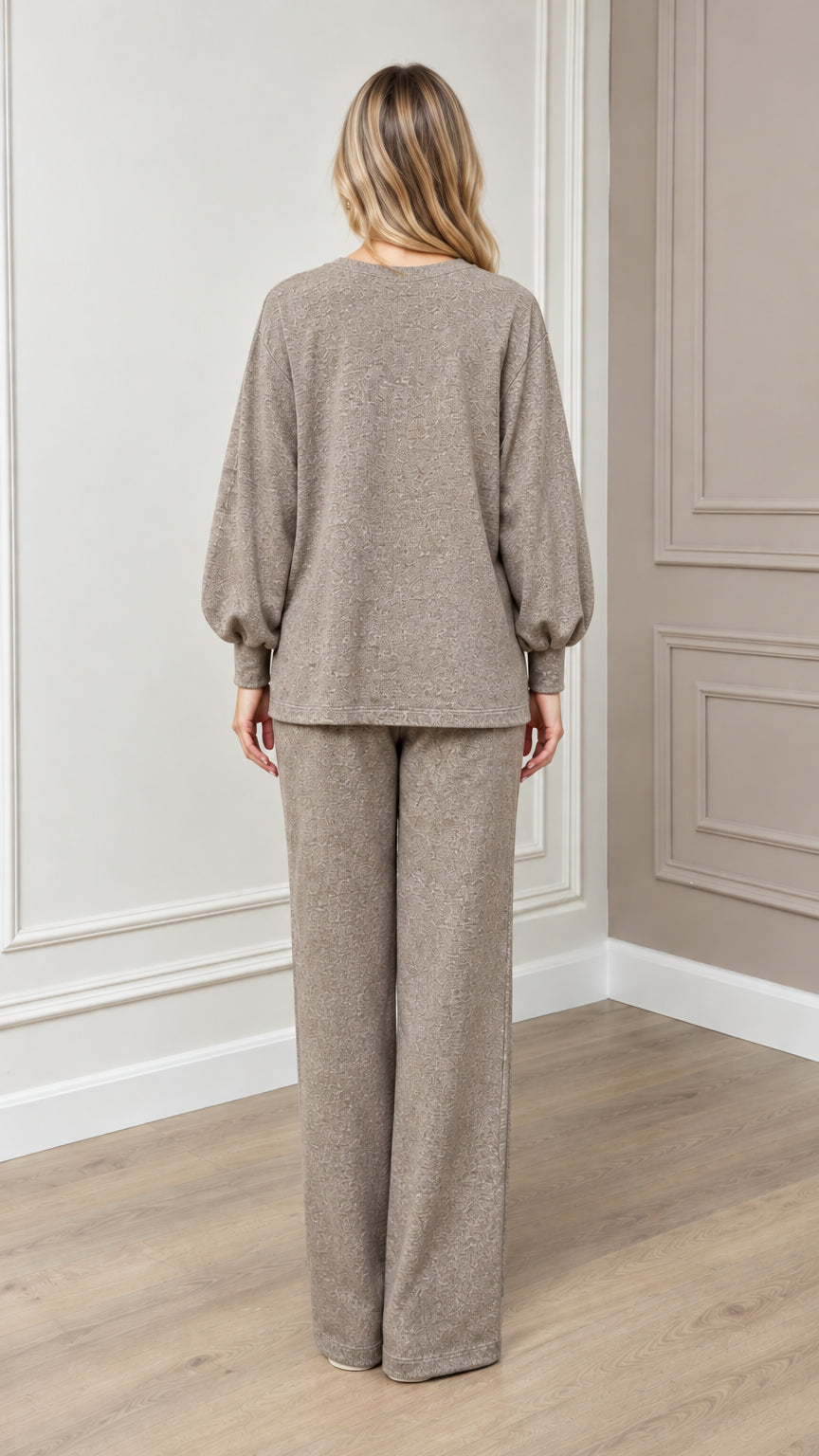 Back view of model wearing relaxed taupe matching lounge set