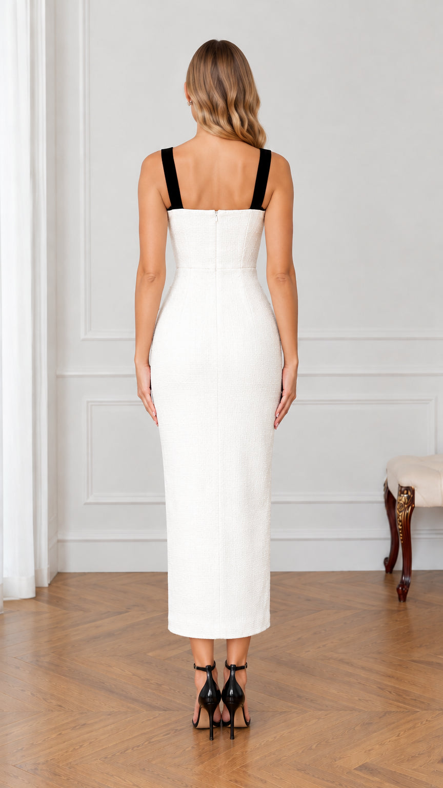 Back view of white fitted tweed midi dress with black straps and zipper