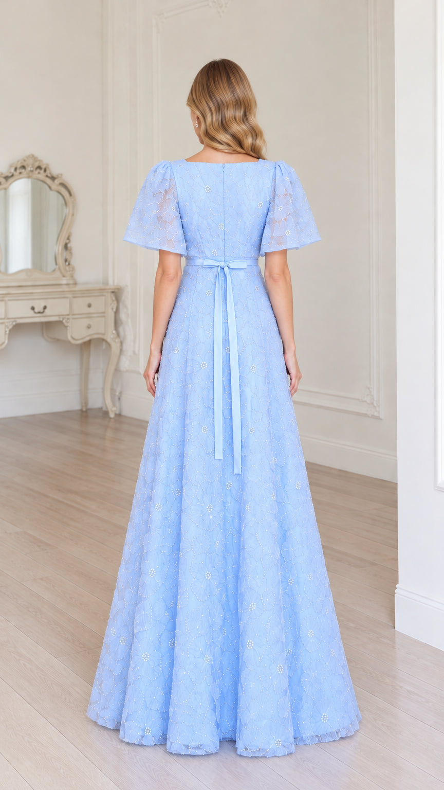Back view of sky blue A-line maxi dress showing square back and ribbon bow tie