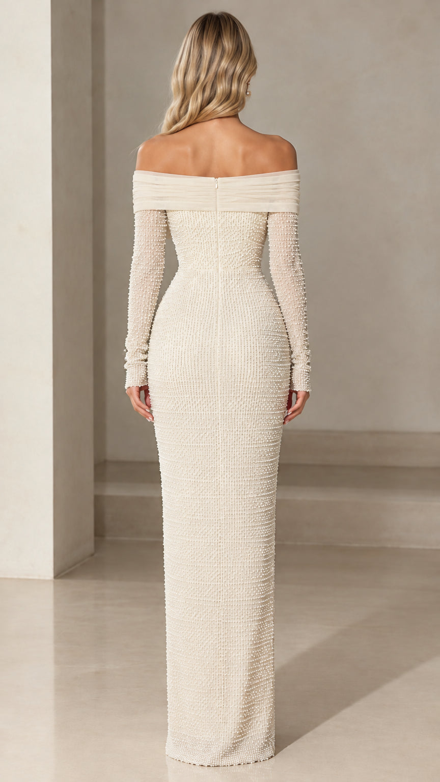 Back view of model wearing ivory long sleeve pearl maxi dress with concealed zipper
