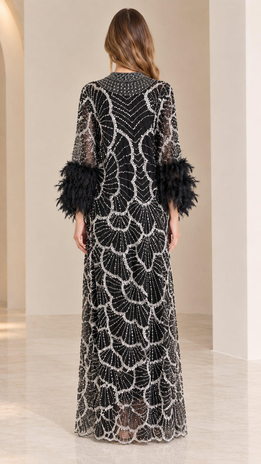 Back view of model wearing black high neck beaded floor-length dress