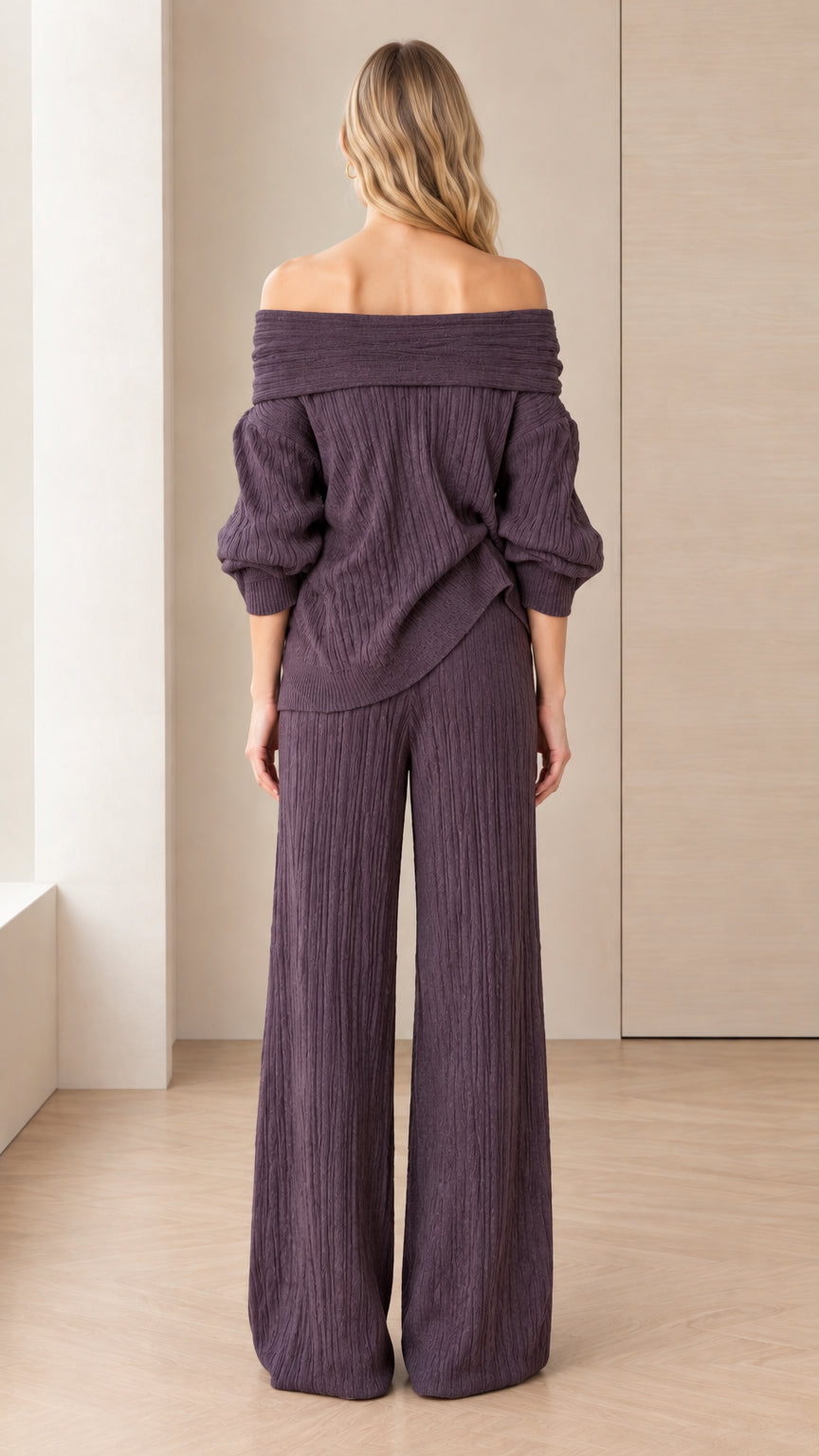 Back view of model in off-the-shoulder dark plum wide-leg pants matching set