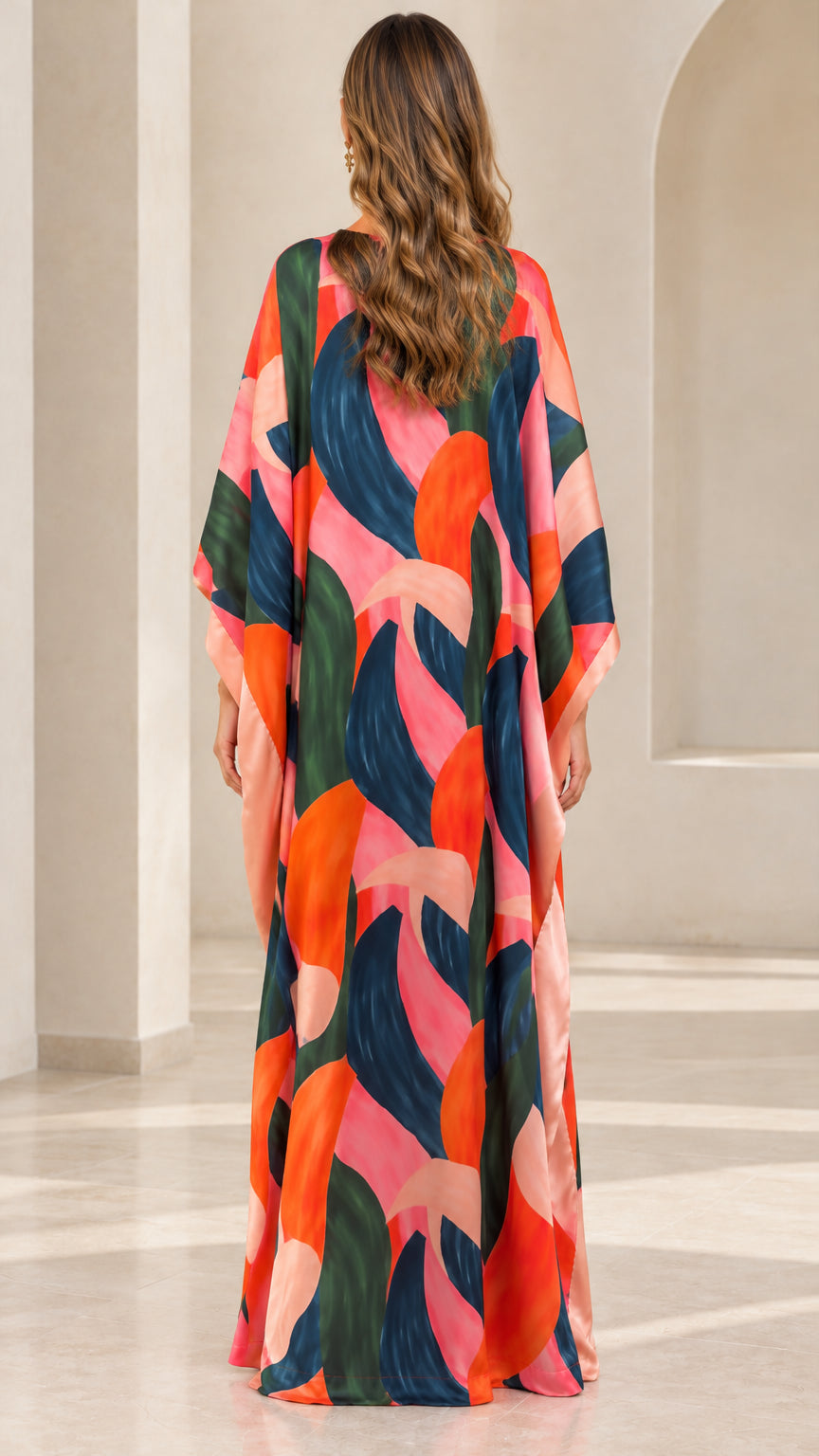 Back full-length view of woman in colorful brushstroke print kaftan dress