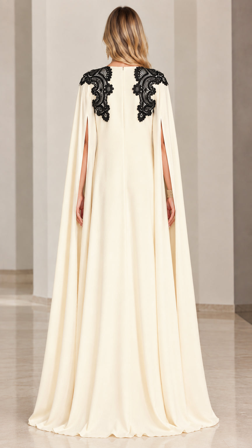 Back view of cream cape gown highlighting shoulder lace appliques