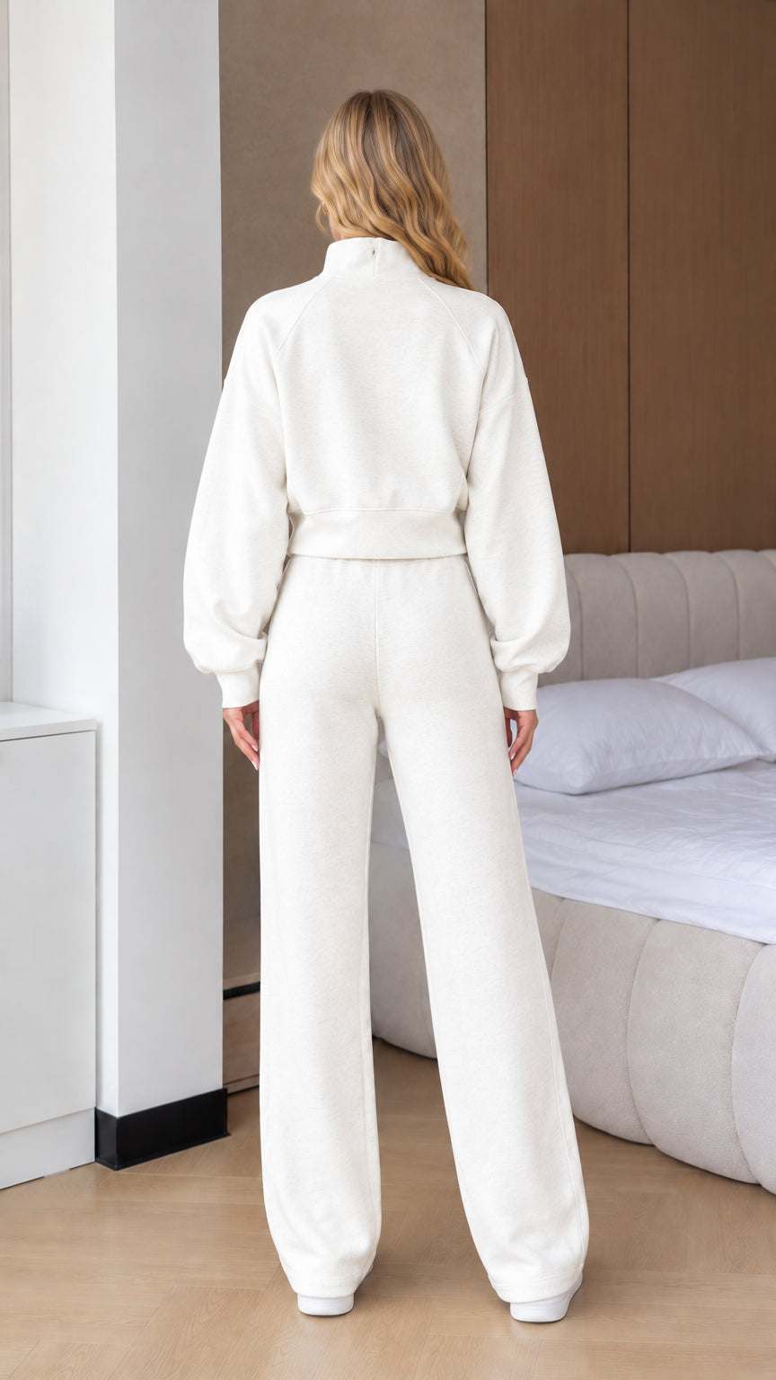 Back view of woman wearing Off White full-zip jacket and wide leg tracksuit set