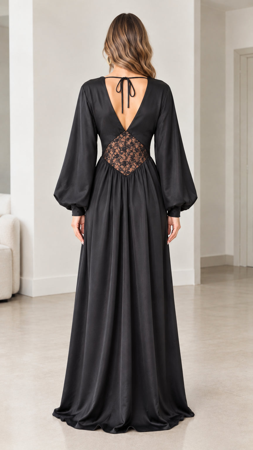Back view of black satin dress showing open V-back with self-tie detail