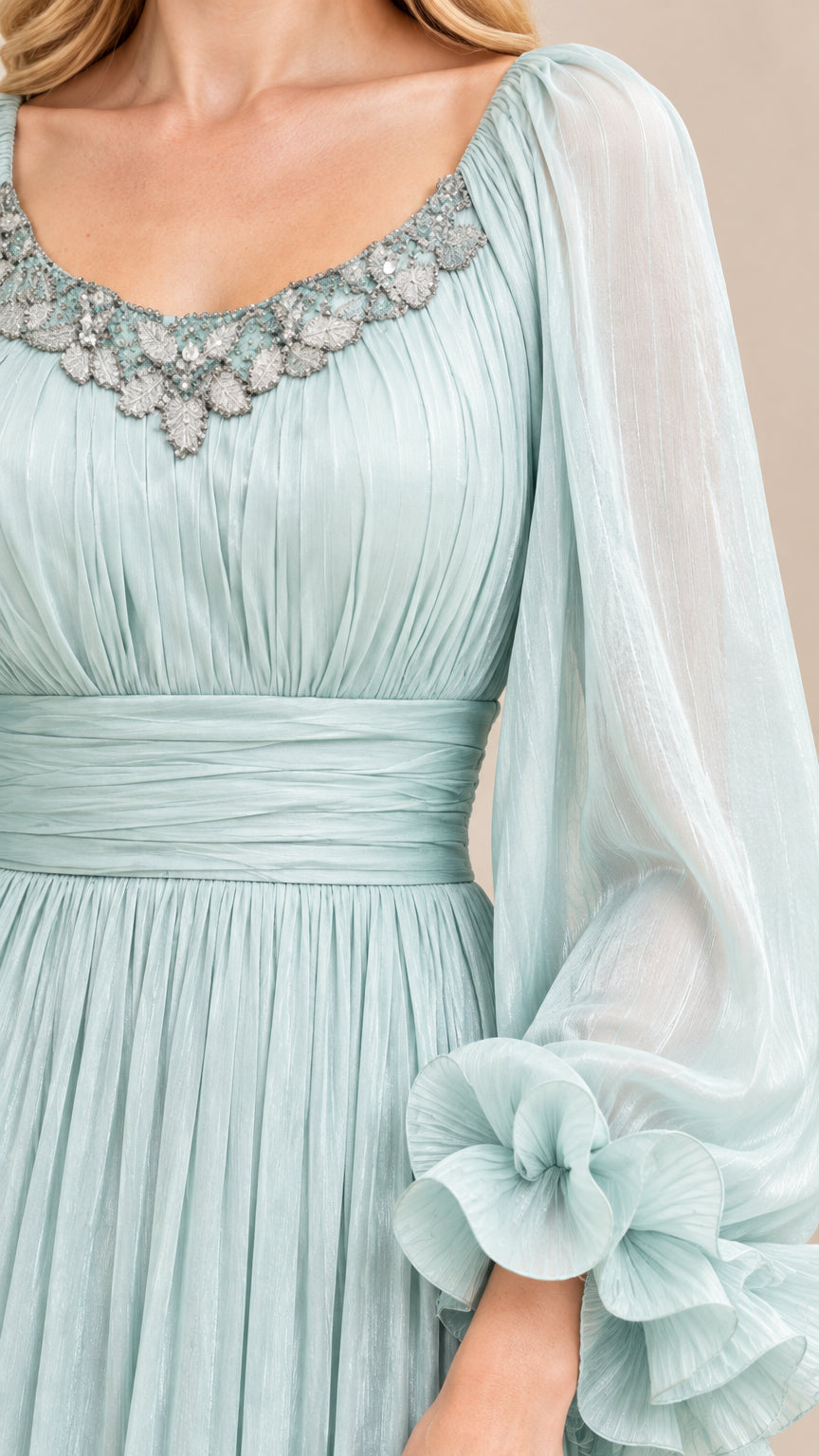 Close-up detail of embellished scoop neckline, ruched bodice, and tiered ruffle sleeve cuff on Mint Green dress