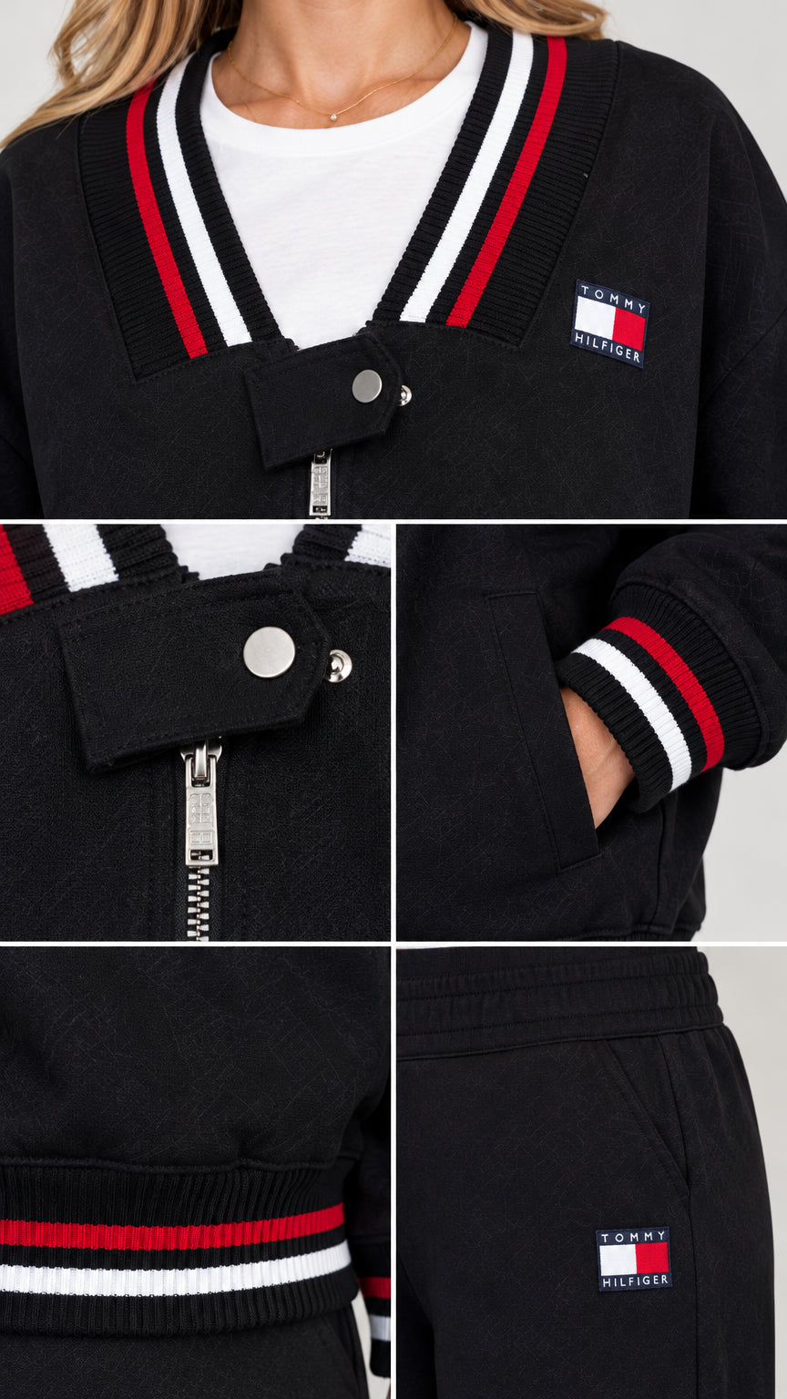 Close-up details of striped V-neck collar, snap tab zipper, and embroidered patch