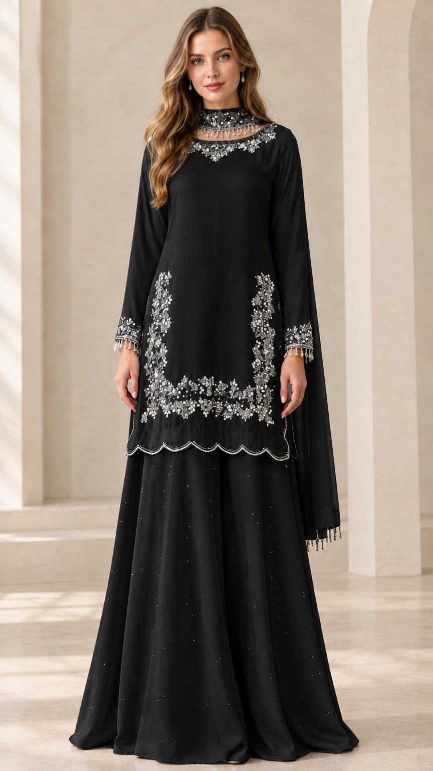 Full-length view of woman wearing Black embroidered sharara suit set