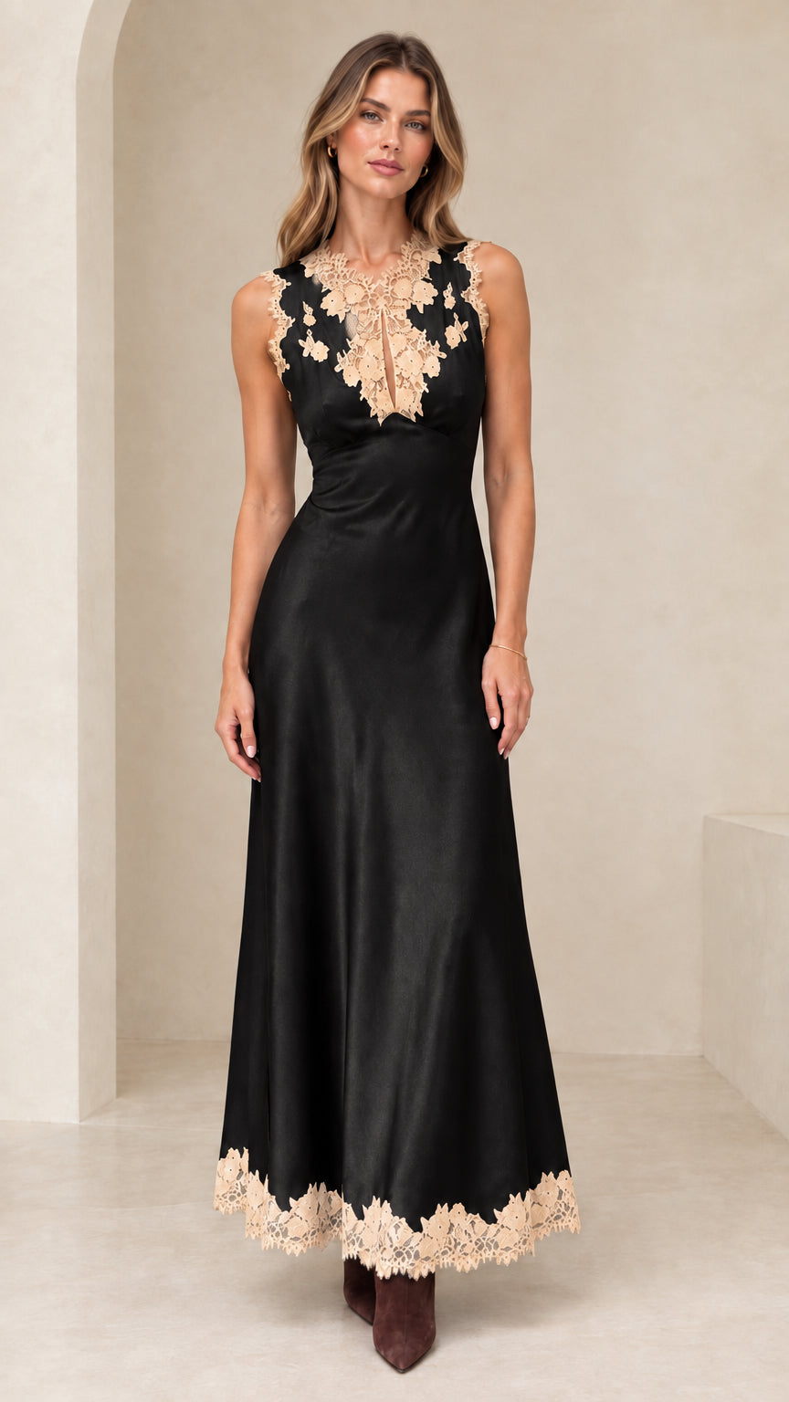 Model wearing black satin maxi dress with contrasting beige lace trim