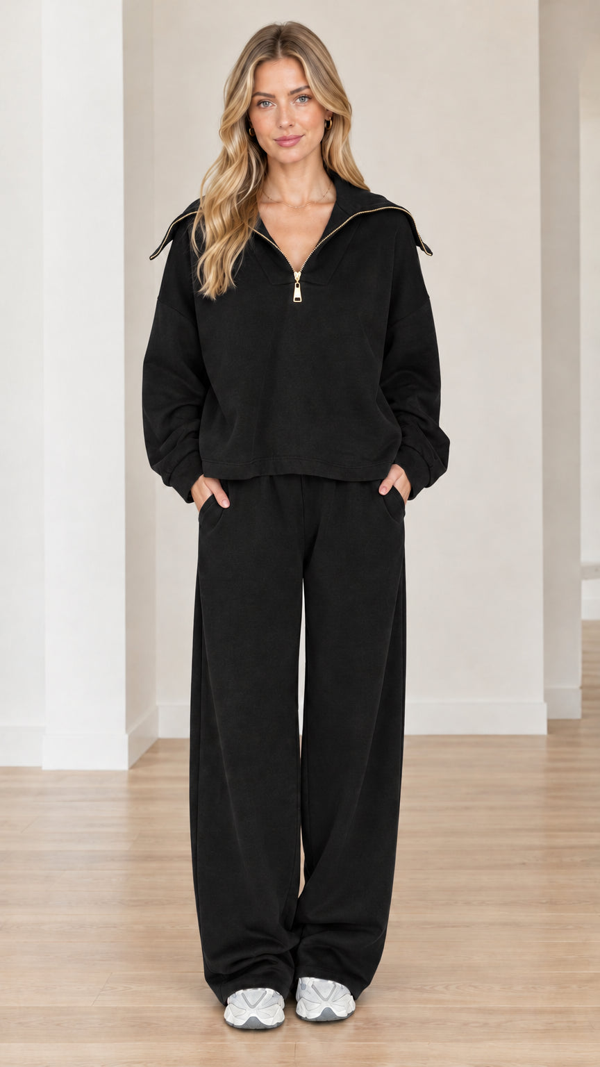 Model wearing black half-zip sailor collar sweatshirt and wide-leg pants matching set