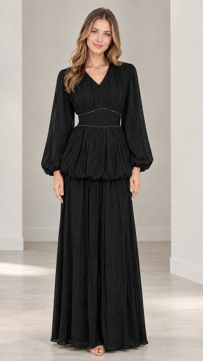 Front full view of black pleated long sleeve maxi dress