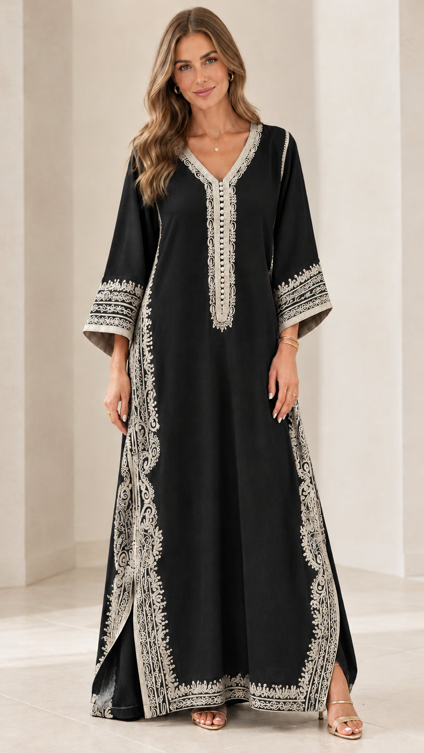Full-length front view of black embroidered kaftan maxi dress