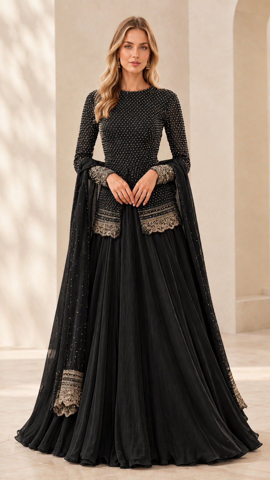 Front full view of black embellished long sleeve peplum top and pleated maxi skirt set