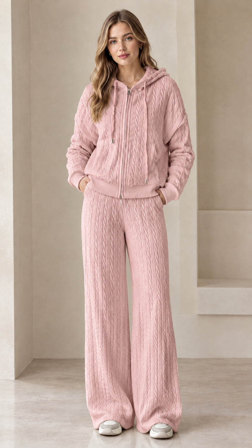 Full-length view of woman wearing dusty pink textured knit zip hoodie and wide leg tracksuit