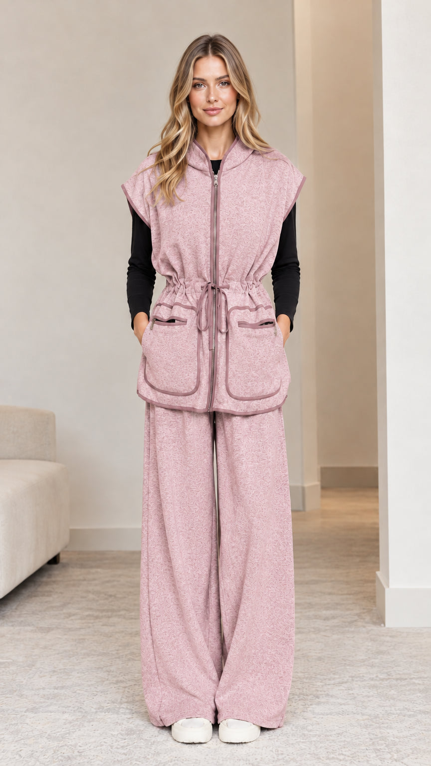 Model wearing dusty pink 2-piece hooded vest and wide-leg pants set