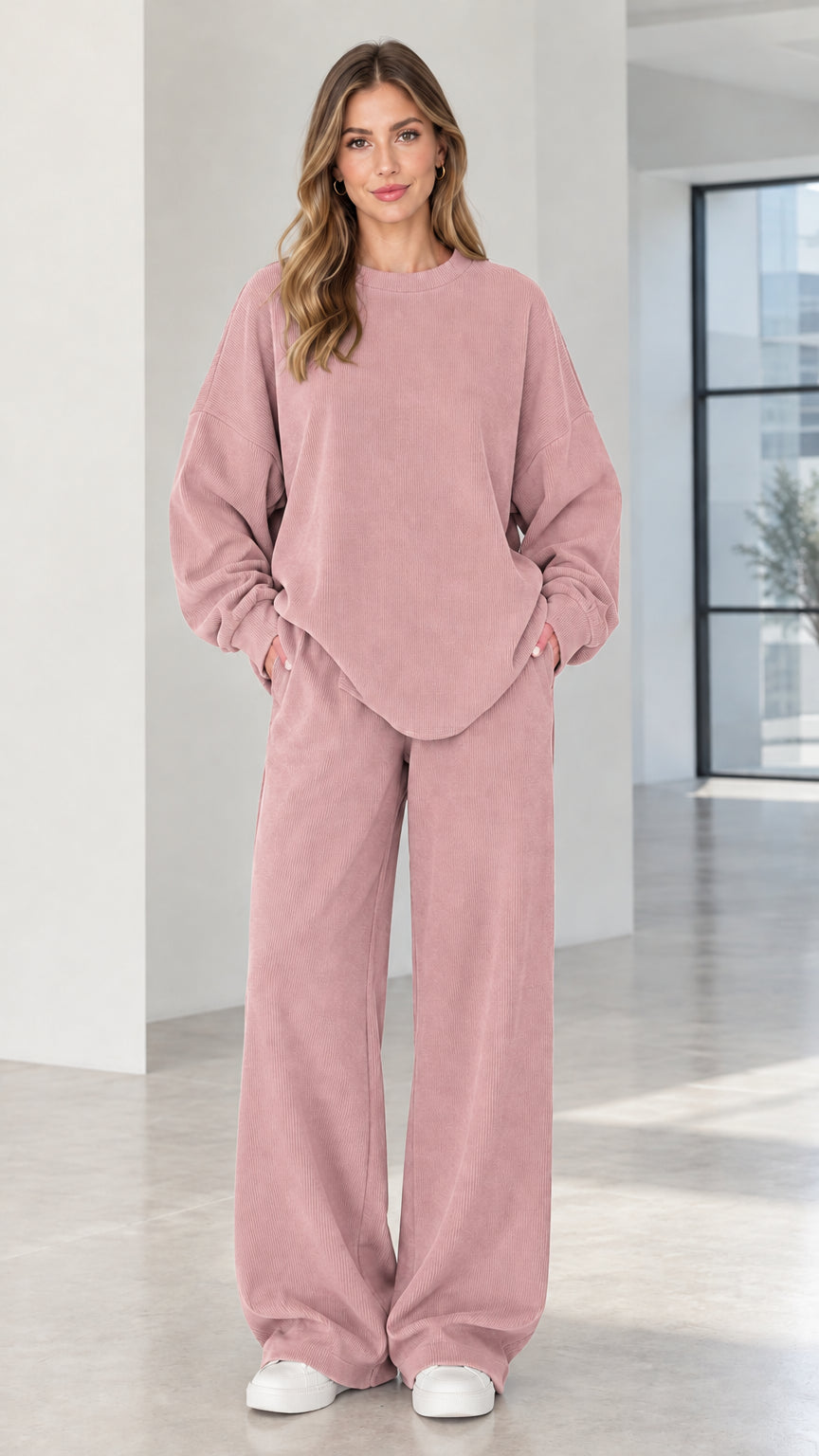 Woman wearing dusty pink two-piece ribbed matching lounge set with pockets