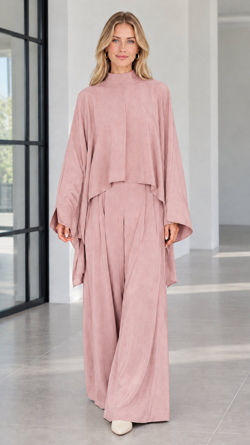 Front view of dusty pink draped cape top and matching wide leg trousers