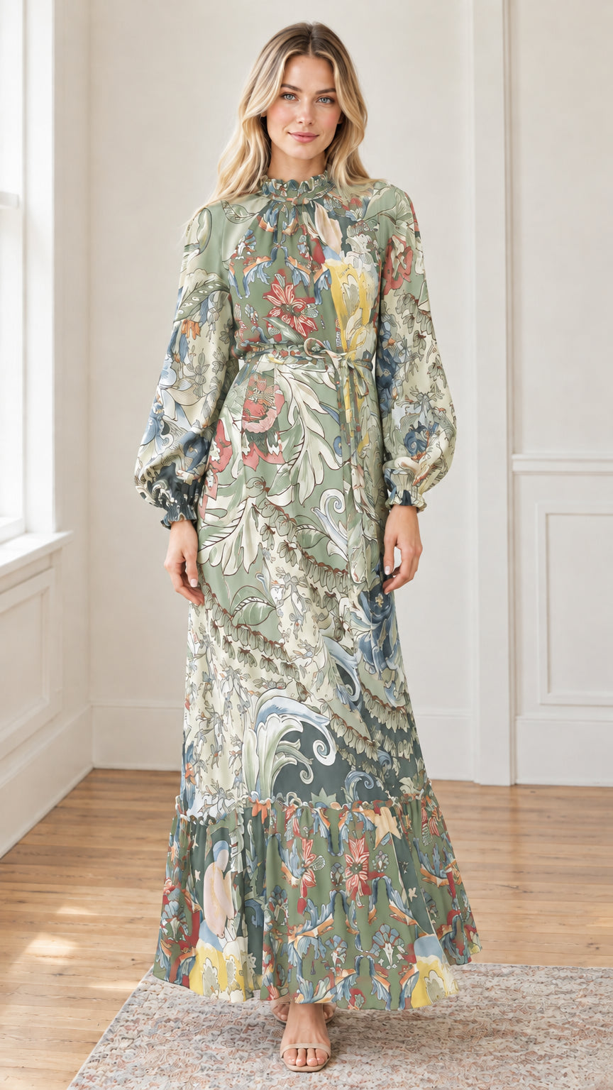 Woman modeling elegant botanical print belted maxi dress in sage green multi